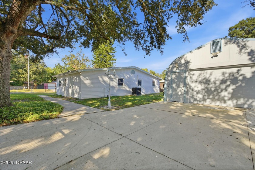 This beautifully renovated 3-bedroom concrete block home tucked - Beach Home for sale in Daytona Beach, Florida on Beachhouse.com