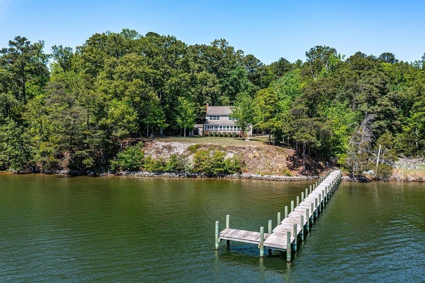 Elevated above the shoreline along the Corrotoman River, this - Beach Home for sale in Lancaster, Virginia on Beachhouse.com