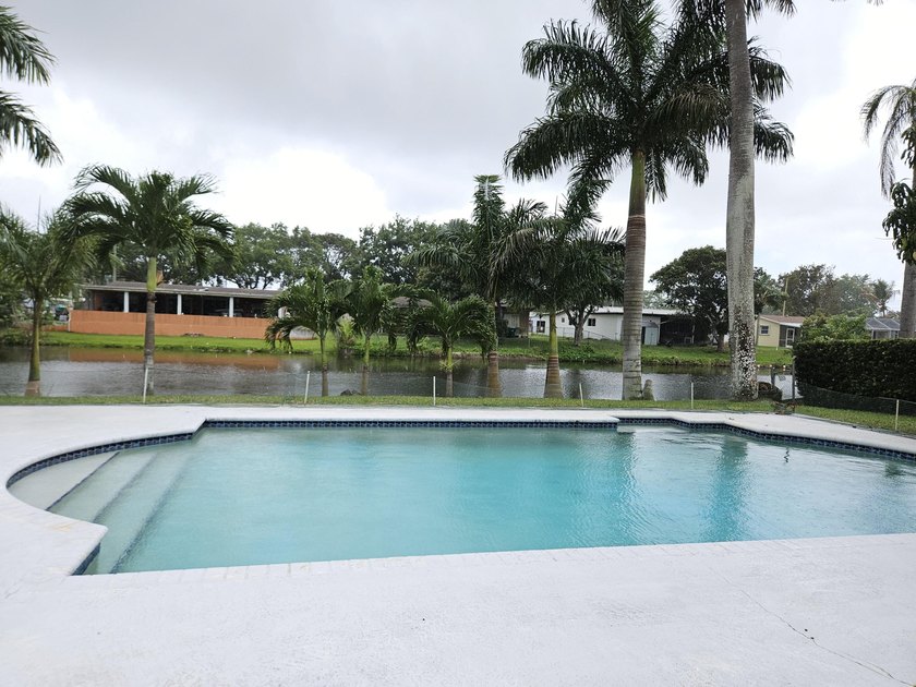 Lovely waterfront Cooper City pool home with a screened in - Beach Home for sale in Cooper City, Florida on Beachhouse.com