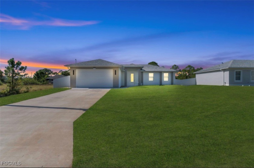 Stunning new construction featuring 3 bedrooms + den, and 3 full - Beach Home for sale in Lehigh Acres, Florida on Beachhouse.com