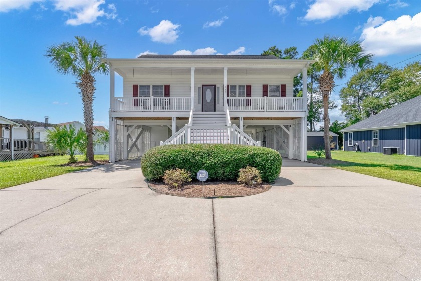 With no homeowners association and only a half mile from the - Beach Home for sale in Garden City Beach, South Carolina on Beachhouse.com