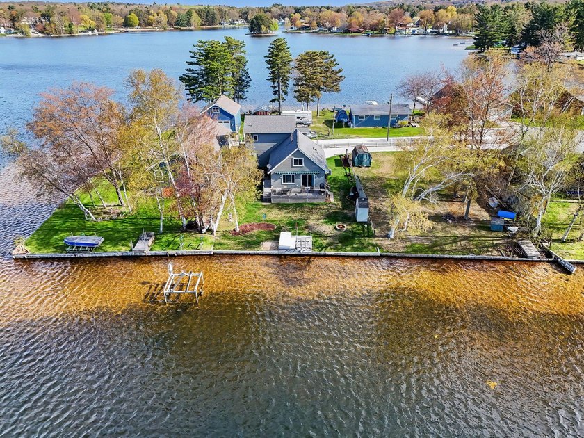 Enjoy year-round lake living with private frontage on beautiful - Beach Home for sale in Mears, Michigan on Beachhouse.com