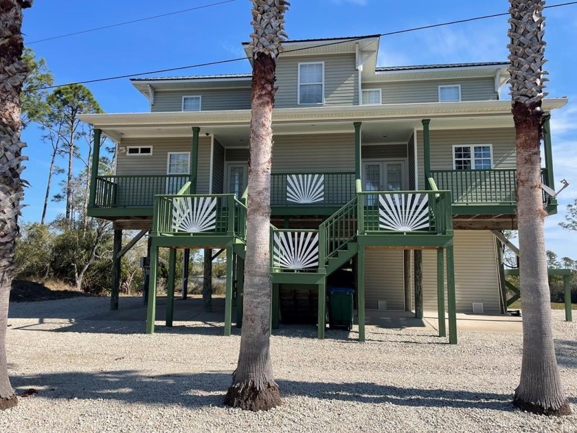 This custom-built home offers a unique blend of luxury and - Beach Home for sale in Carabelle, Florida on Beachhouse.com