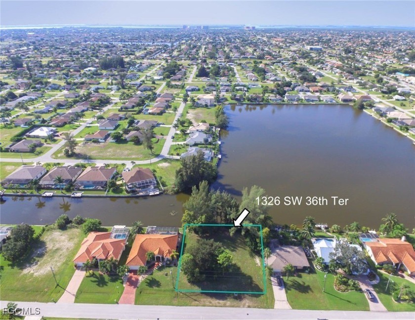 Overlooking LAKE MEMORY: Large freshwater LAKEFRONT TRIPLE-LOT - Beach Lot for sale in Cape Coral, Florida on Beachhouse.com