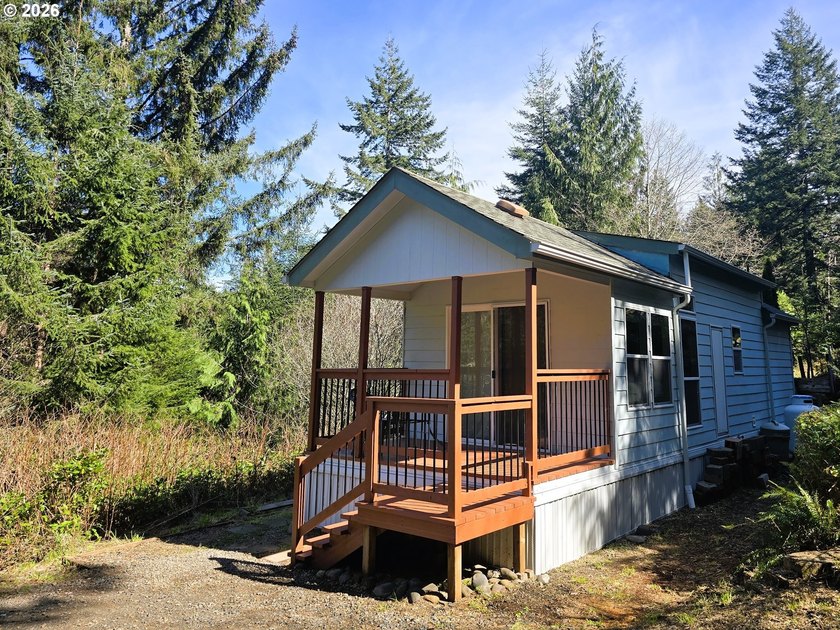 Tucked away in the trees just minutes from Sutton Lake and Buck - Beach Home for sale in Florence, Oregon on Beachhouse.com