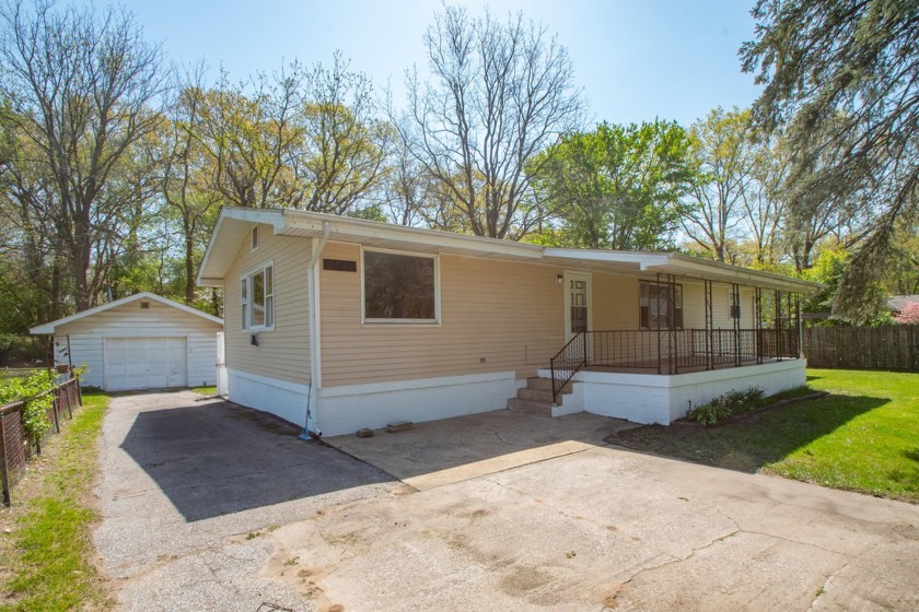 Sitting on just under a half of an acre partially fenced, this - Beach Home for sale in Portage, Indiana on Beachhouse.com