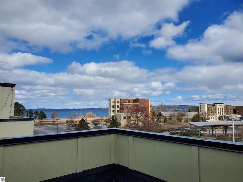 Welcome to urban living at its finest! This exceptional end unit - Beach Condo for sale in Traverse City, Michigan on Beachhouse.com