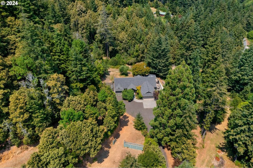 Discover the charm and tranquility of this unique 5-bedroom - Beach Home for sale in Gold Beach, Oregon on Beachhouse.com