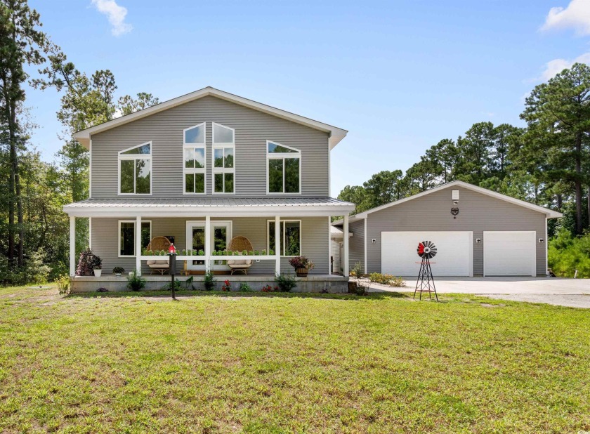 Welcome to this custom-built home nestled on 5 acres, offering - Beach Home for sale in Longs, South Carolina on Beachhouse.com