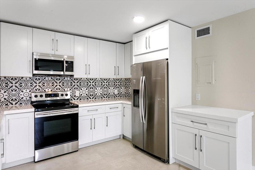 Come see this rare 2BR + DEN, 2BA FIRST FLOOR end unit that is - Beach Condo for sale in Hypoluxo, Florida on Beachhouse.com