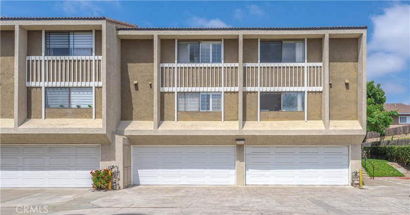 Step into the inviting charm of this 3-bedroom, 3-bathroom end - Beach Condo for sale in Costa Mesa, California on Beachhouse.com