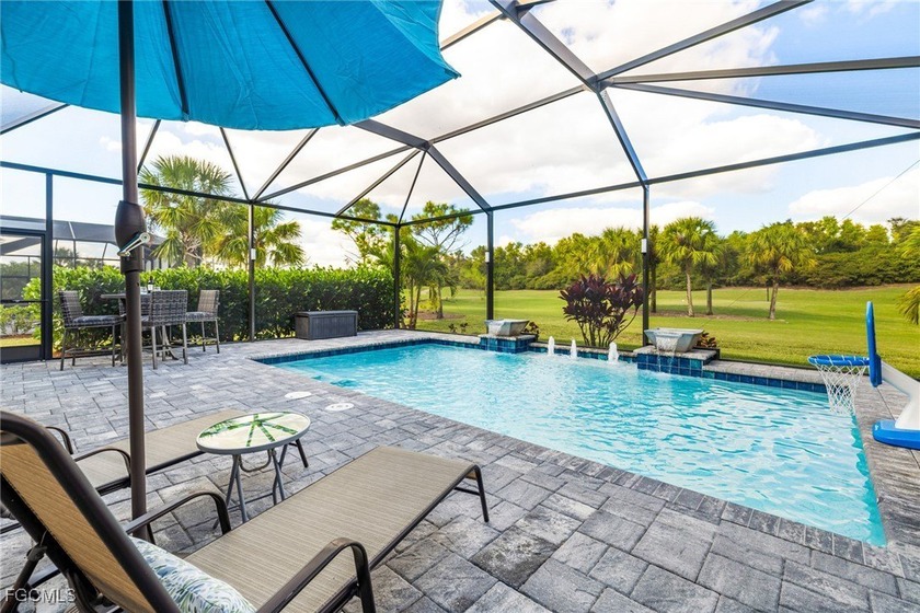 The stunning saltwater pool is the focal point of this exquisite - Beach Home for sale in Fort Myers, Florida on Beachhouse.com