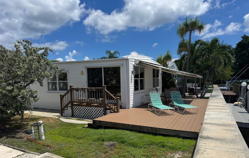 Nice double wide unit ON THE CANAL WITH A DOCK and a 400SF+/- - Beach Home for sale in Briny Breezes, Florida on Beachhouse.com