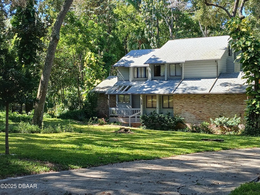 Half an acre, natural woods, and a creek. This original JK - Beach Home for sale in Ormond Beach, Florida on Beachhouse.com