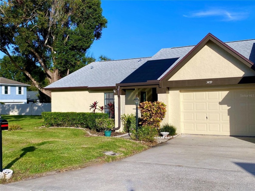 Enjoy FREE GOLF and MAINTENANCE-FREE LIVING in this Villa that - Beach Home for sale in Palm Harbor, Florida on Beachhouse.com