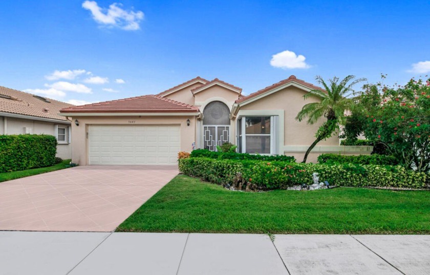 Enjoy the lovely lake view from the large screen enclosed patio - Beach Home for sale in Boynton Beach, Florida on Beachhouse.com