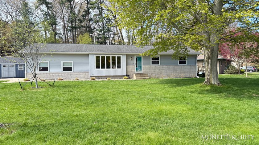 Nestled in the heart of desirable Norton Shores and just minutes - Beach Home for sale in Norton Shores, Michigan on Beachhouse.com