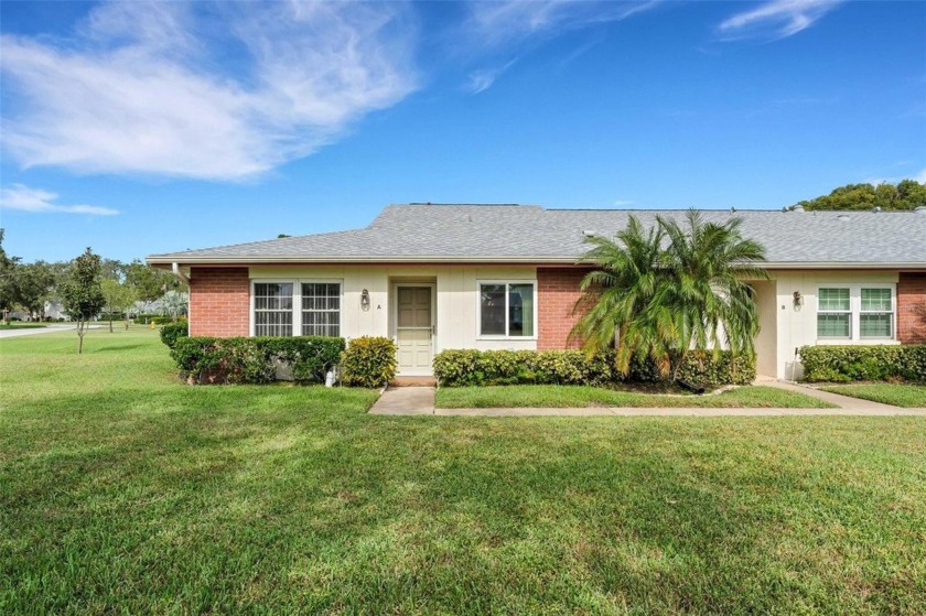 This beautiful 2 bed 2 bath end-unit villa is going to make you - Beach Home for sale in Palm Harbor, Florida on Beachhouse.com