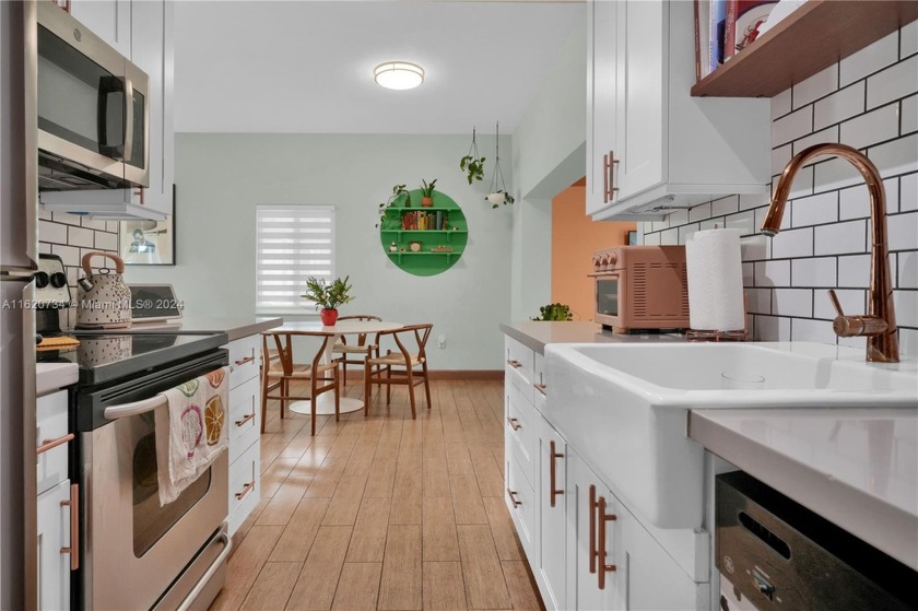 This beautiful turnkey home features an updated kitchen with - Beach Home for sale in Miami, Florida on Beachhouse.com