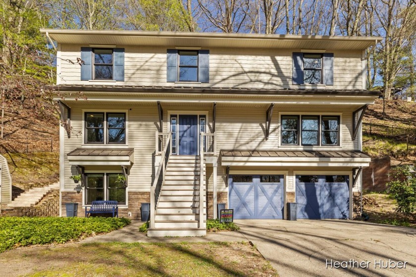 Just steps from Lake Michigan, this stunning modern retreat - Beach Home for sale in Grand Haven, Michigan on Beachhouse.com