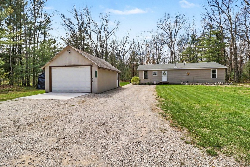 Nestled in the heart of Manistee National Forest, this updated 2 - Beach Home for sale in Manistee, Michigan on Beachhouse.com