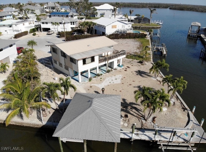 Almost 200 Feet of waterfront! Current 3 bed/2 bath home sits on - Beach Home for sale in Fort Myers Beach, Florida on Beachhouse.com