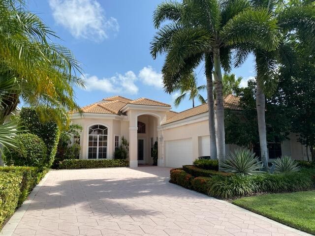 OVERLOOKING EXQUISITE LANDSCAPING AND THE BACK OF A GREEN, THIS - Beach Home for sale in Palm Beach Gardens, Florida on Beachhouse.com