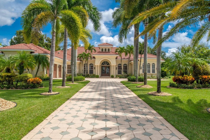 This stunning 5BR/4BA + office home sits on a landscaped & - Beach Home for sale in West Palm Beach, Florida on Beachhouse.com