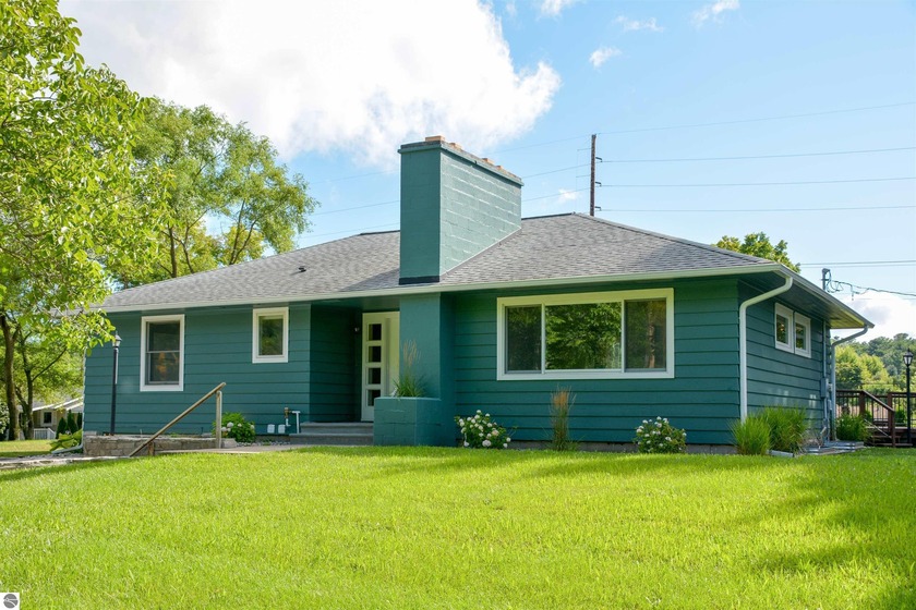 Welcome to this captivating mid-century modern, ranch style home - Beach Home for sale in Traverse City, Michigan on Beachhouse.com