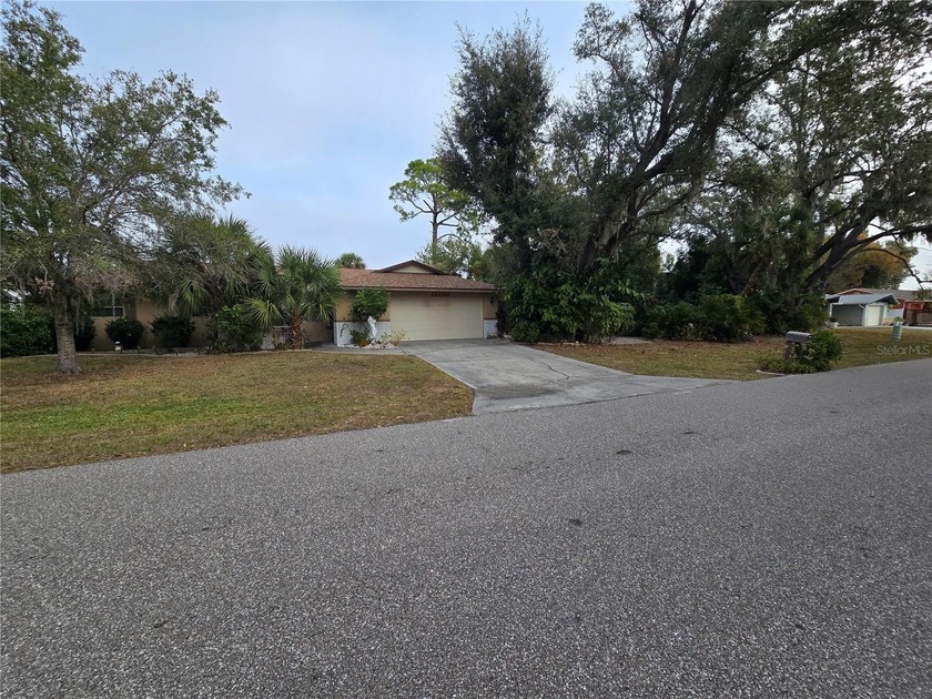 This exceptionally well-maintained 3-bedroom, 2-bath home sits - Beach Home for sale in Port Charlotte, Florida on Beachhouse.com