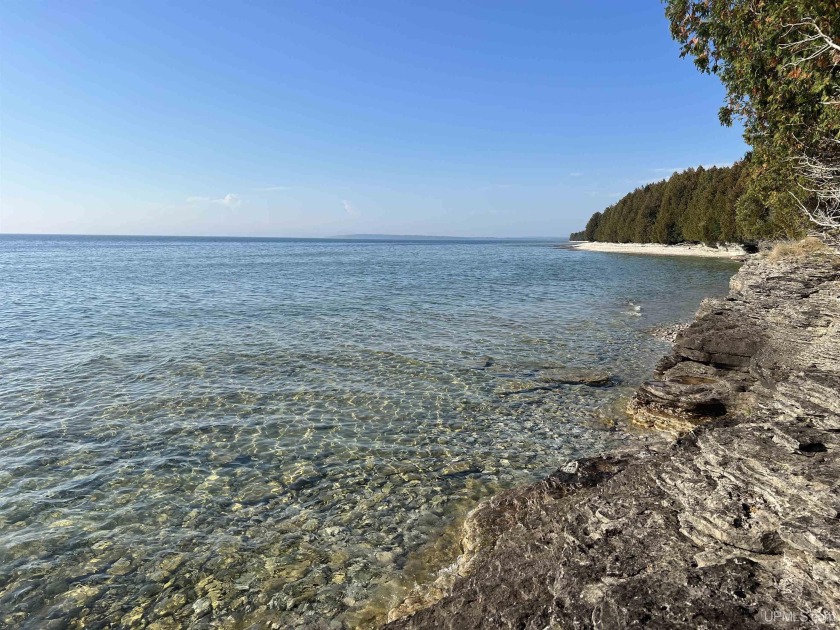 Escape to your own private island paradise with this - Beach Acreage for sale in Garden, Michigan on Beachhouse.com