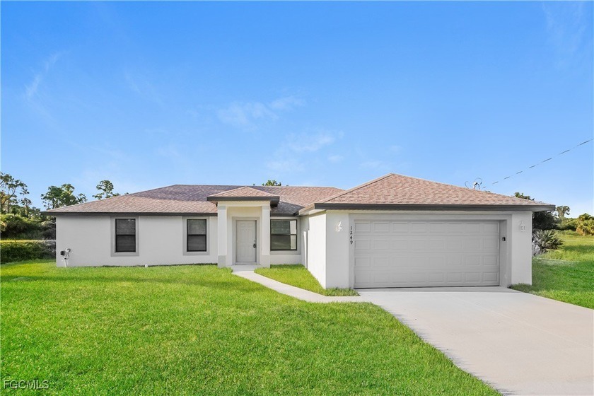 Experience modern living in this 4 bedroom, 2 bathroom home - Beach Home for sale in Lehigh Acres, Florida on Beachhouse.com