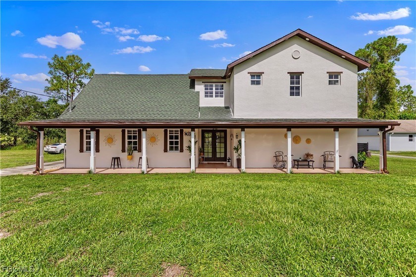 Welcome to this MASSIVE 2 story CONCRETE 3 bed + upstairs LOFT 2 - Beach Home for sale in Lehigh Acres, Florida on Beachhouse.com