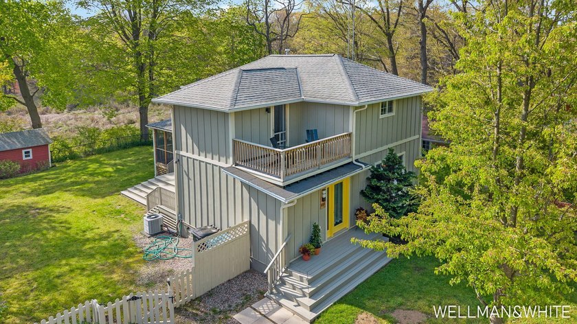 Nestled on a large, sun drenched lot just blocks from downtown - Beach Home for sale in Saugatuck, Michigan on Beachhouse.com