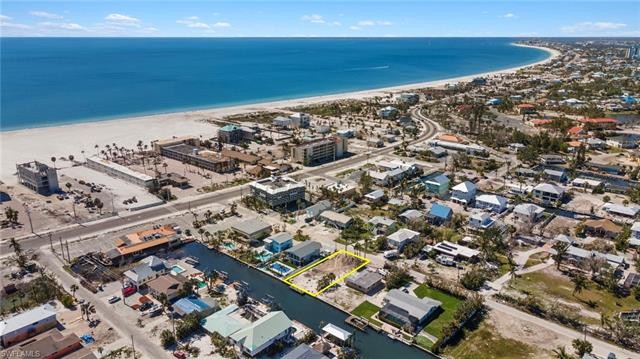 A PERFECTLY located Gulf Access Waterfront Beach Cottage - Beach Lot for sale in Fort Myers Beach, Florida on Beachhouse.com