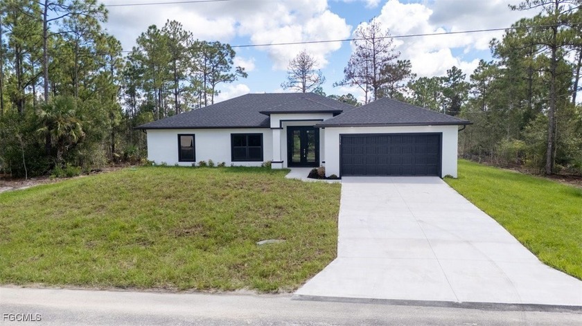 Brand-new construction on a .5-acre lot! This 3 bedroom, 2 bath - Beach Home for sale in Lehigh Acres, Florida on Beachhouse.com