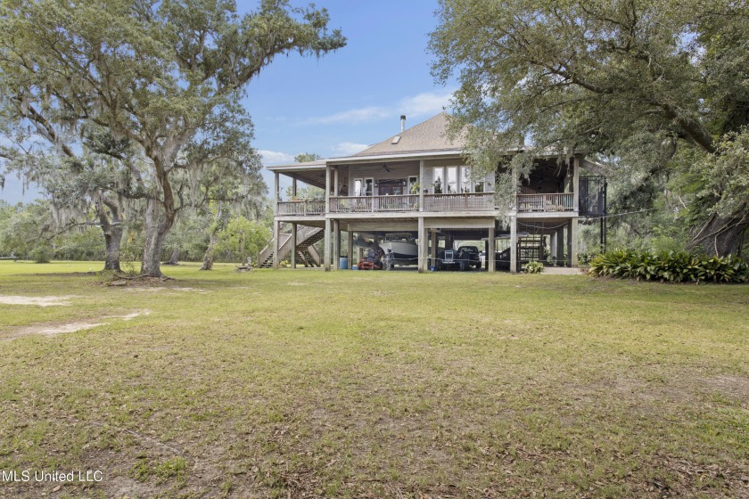 Approximately 5 acres of land, house and Bayou Portage access - - Beach Home for sale in Pass Christian, Mississippi on Beachhouse.com