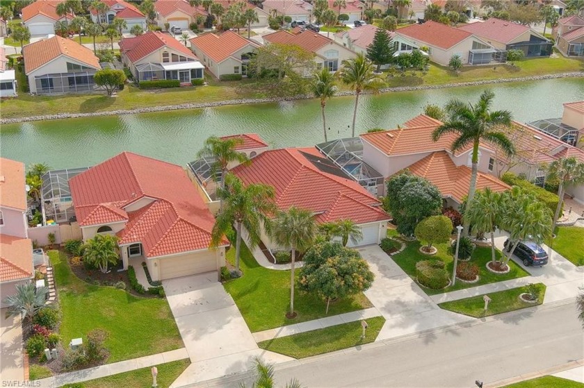 Just listed WATERFRONT POOL home in highly desirable Sabal Lake - Beach Home for sale in Naples, Florida on Beachhouse.com