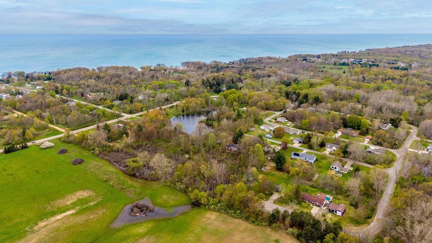 Tucked away in the desirable Scotsonia subdivision, this - Beach Lot for sale in South Haven, Michigan on Beachhouse.com