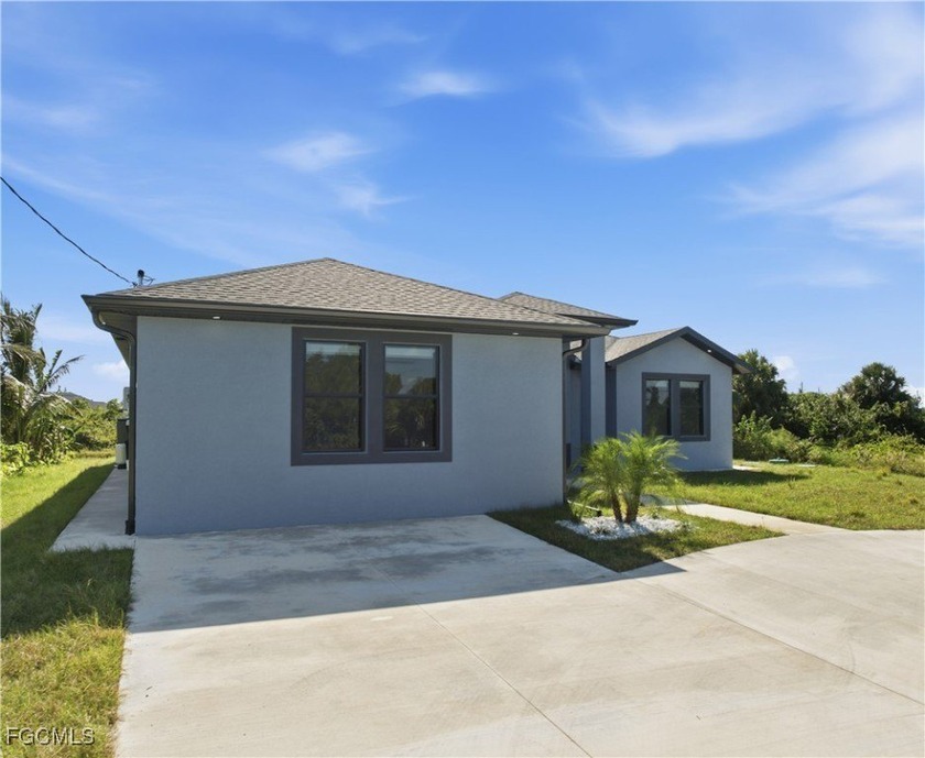 *Welcome to this expansive 5-bedroom, 3-bathroom home with an - Beach Home for sale in Lehigh Acres, Florida on Beachhouse.com