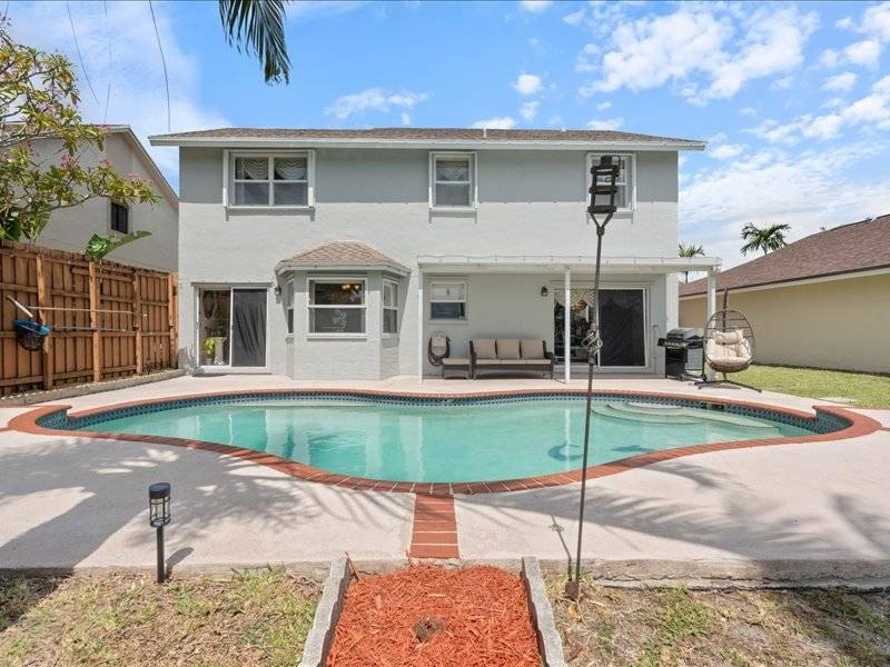 Where Lake Views, Lush Vibes, and Lasting Memories Await - Beach Home for sale in Pembroke Pines, Florida on Beachhouse.com