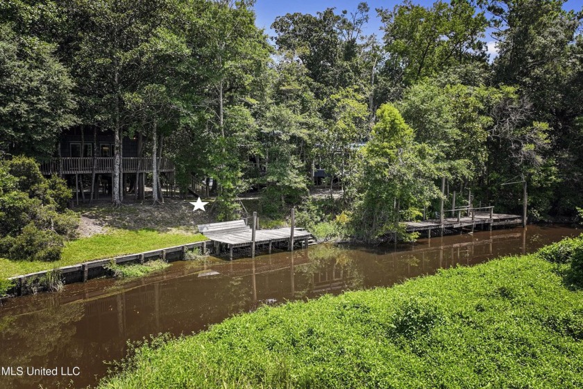 WATERFRONT HOME ON 1 ACRE! Tucked away on a secluded gravel road - Beach Home for sale in D Iberville, Mississippi on Beachhouse.com