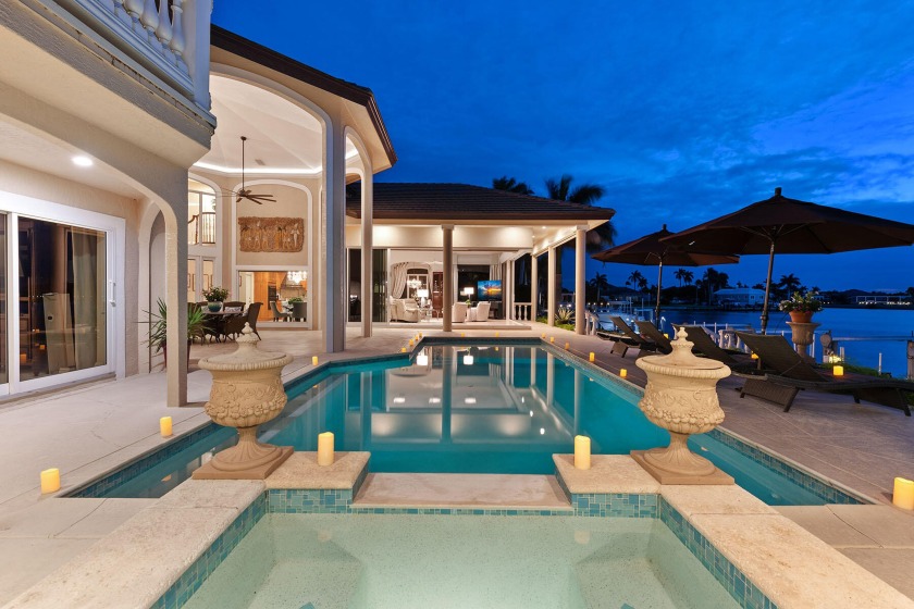 Watch the dolphins and manatee play, from this majestic, 3 - Beach Home for sale in Marco Island, Florida on Beachhouse.com