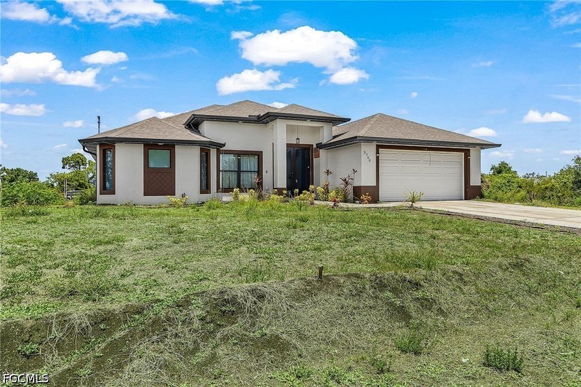 Discover 3700 14th St SW, a rare NO HOA canal-side home - Beach Home for sale in Lehigh Acres, Florida on Beachhouse.com