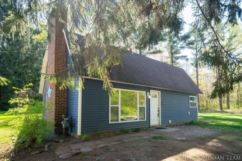 Discover this charming 4-bedroom, 1.5-bathroom home situated on - Beach Home for sale in Holland, Michigan on Beachhouse.com