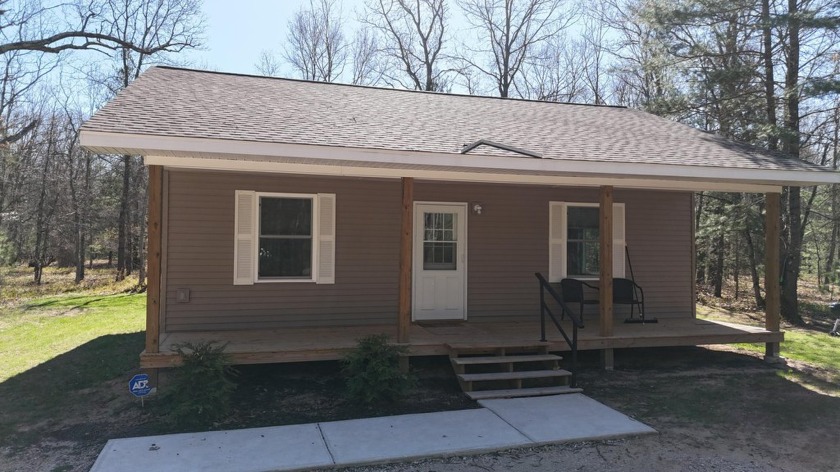 Where peace and quiet meets a bustling business, step onto this - Beach Home for sale in Manistee, Michigan on Beachhouse.com