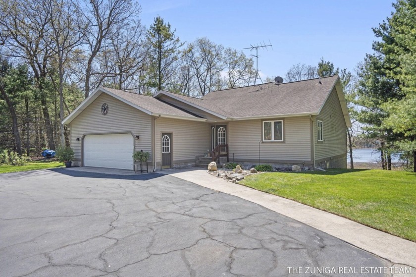WATERFRONT LIVING! Spacious walkout ranch on 3 private acres - Beach Home for sale in Whitehall, Michigan on Beachhouse.com