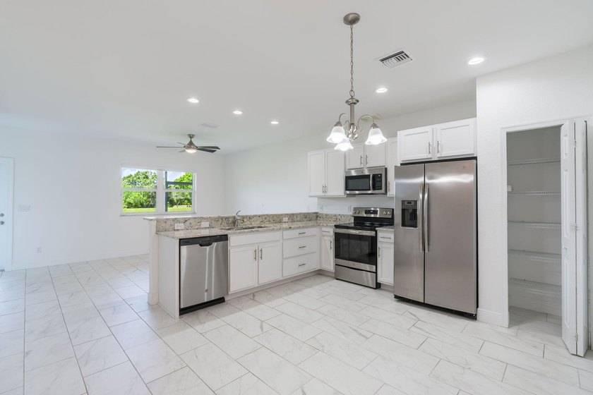 Tucked inside River Place community, this 2-bedroom, 3-bath - Beach Townhome/Townhouse for sale in Port Saint Lucie, Florida on Beachhouse.com