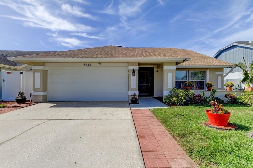 Welcome home to this stunning 3-bedroom, 2-bath pool home in the - Beach Home for sale in Tampa, Florida on Beachhouse.com