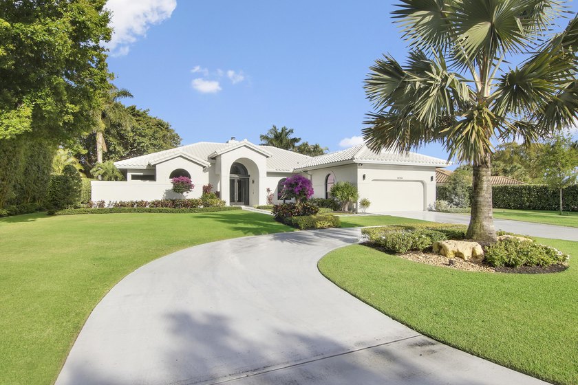 Prepare to be captivated by this custom-built sanctuary where no - Beach Home for sale in Palm Beach Gardens, Florida on Beachhouse.com